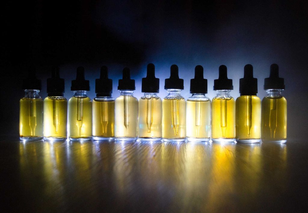 A selection of e-liquid bottles with varying nicotine strengths.